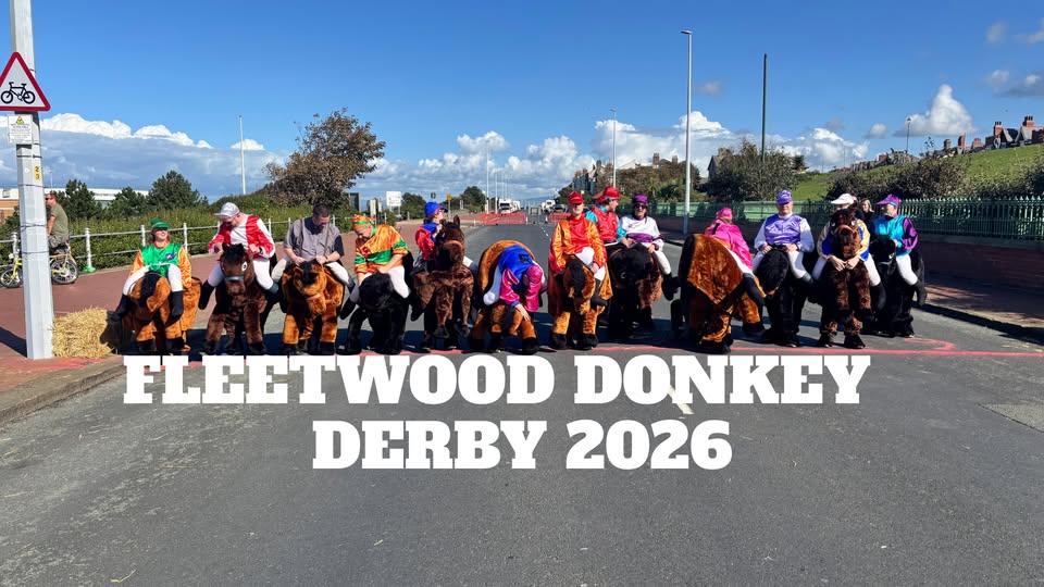 Picture of people dressed as donkeys ready to race