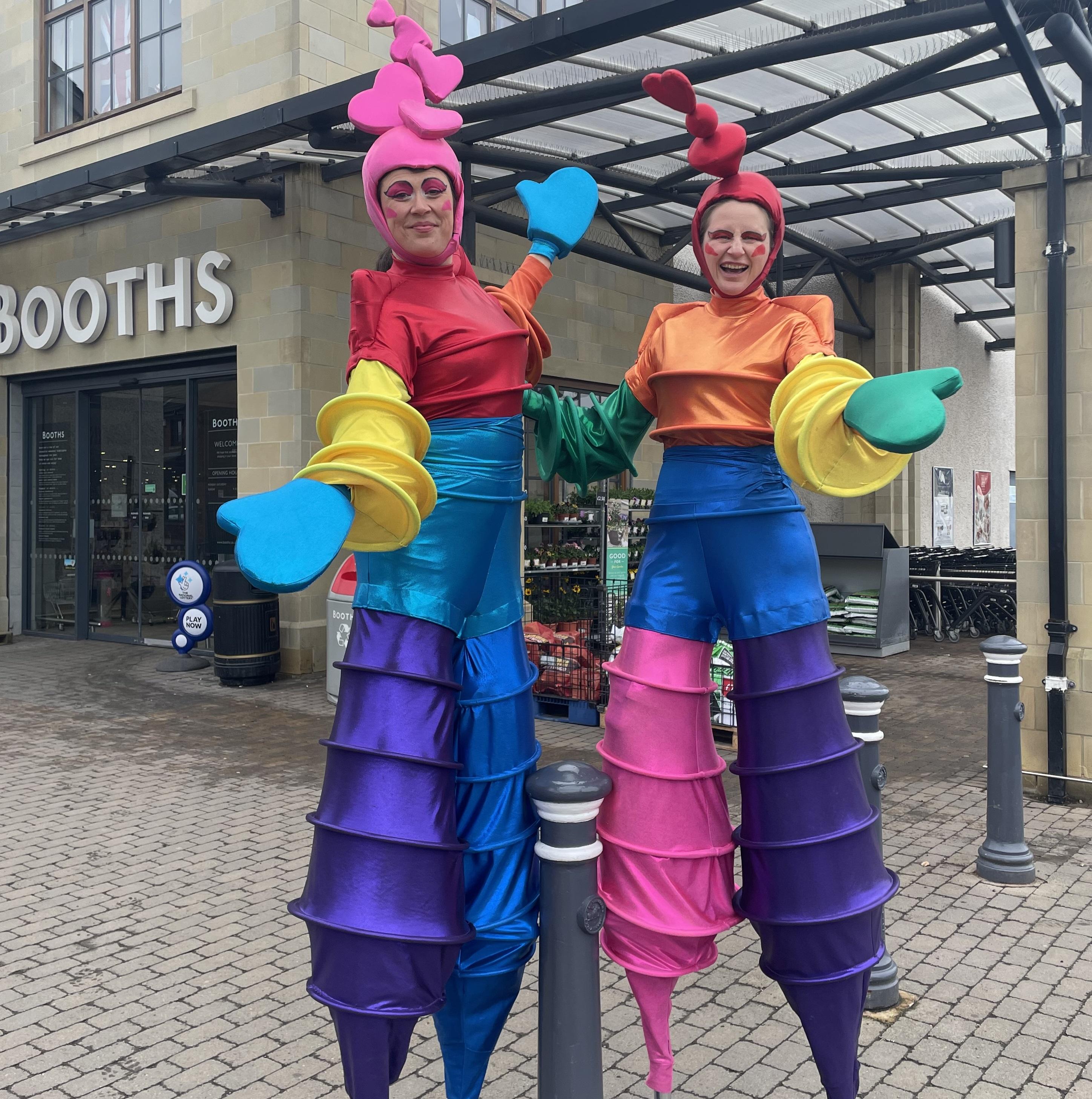 rainbow stilt walkers