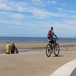 Man cycling on promenade in Cleveleys