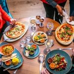 Table of food  on plates and drinks