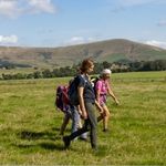 People walking through countryside