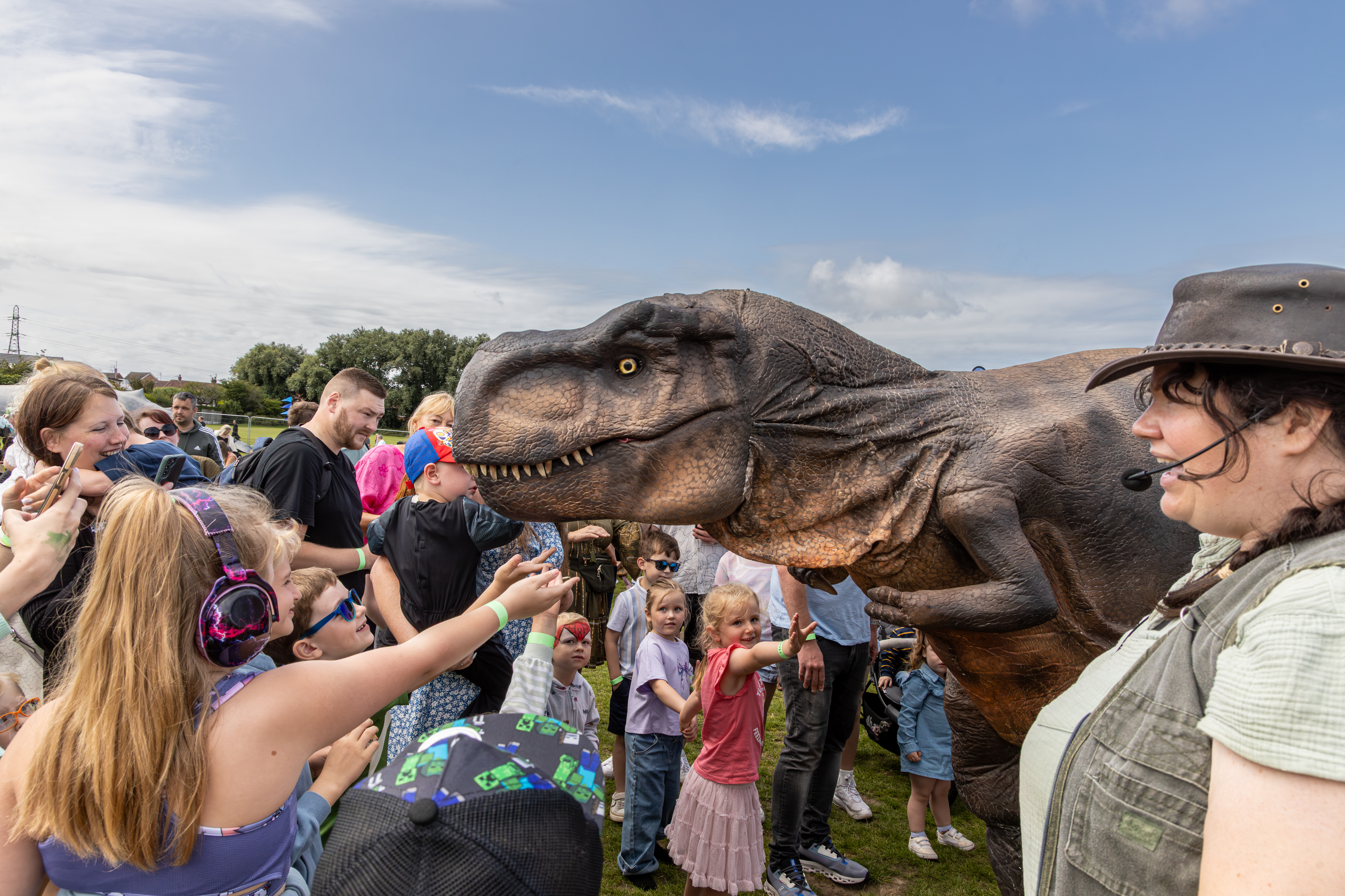 Dinosaur and crowd at Wanderland family festival 2025