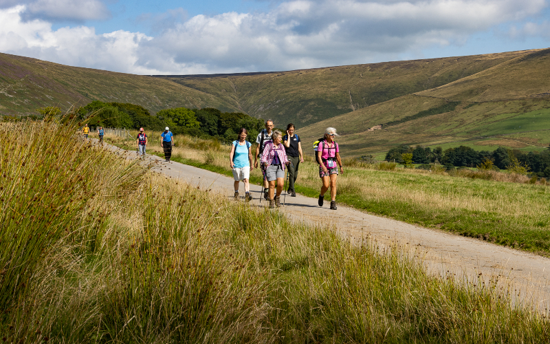 Group walking along a path on some hills in Wyre countryside.