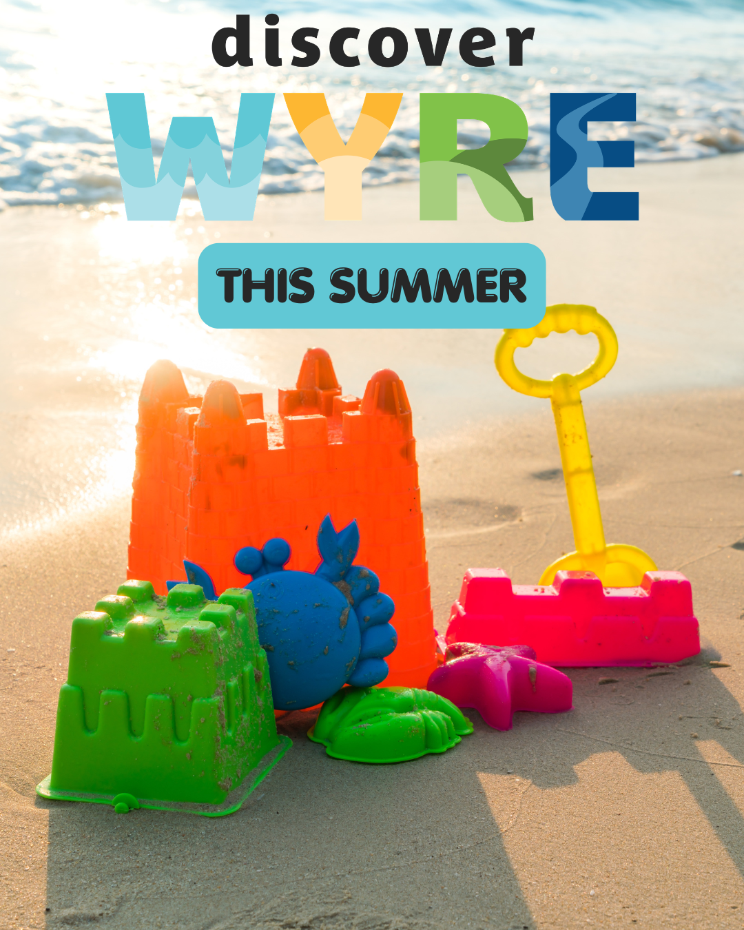 Bucket and spade on sunny beach with Discover Wyre this Summer written over the top