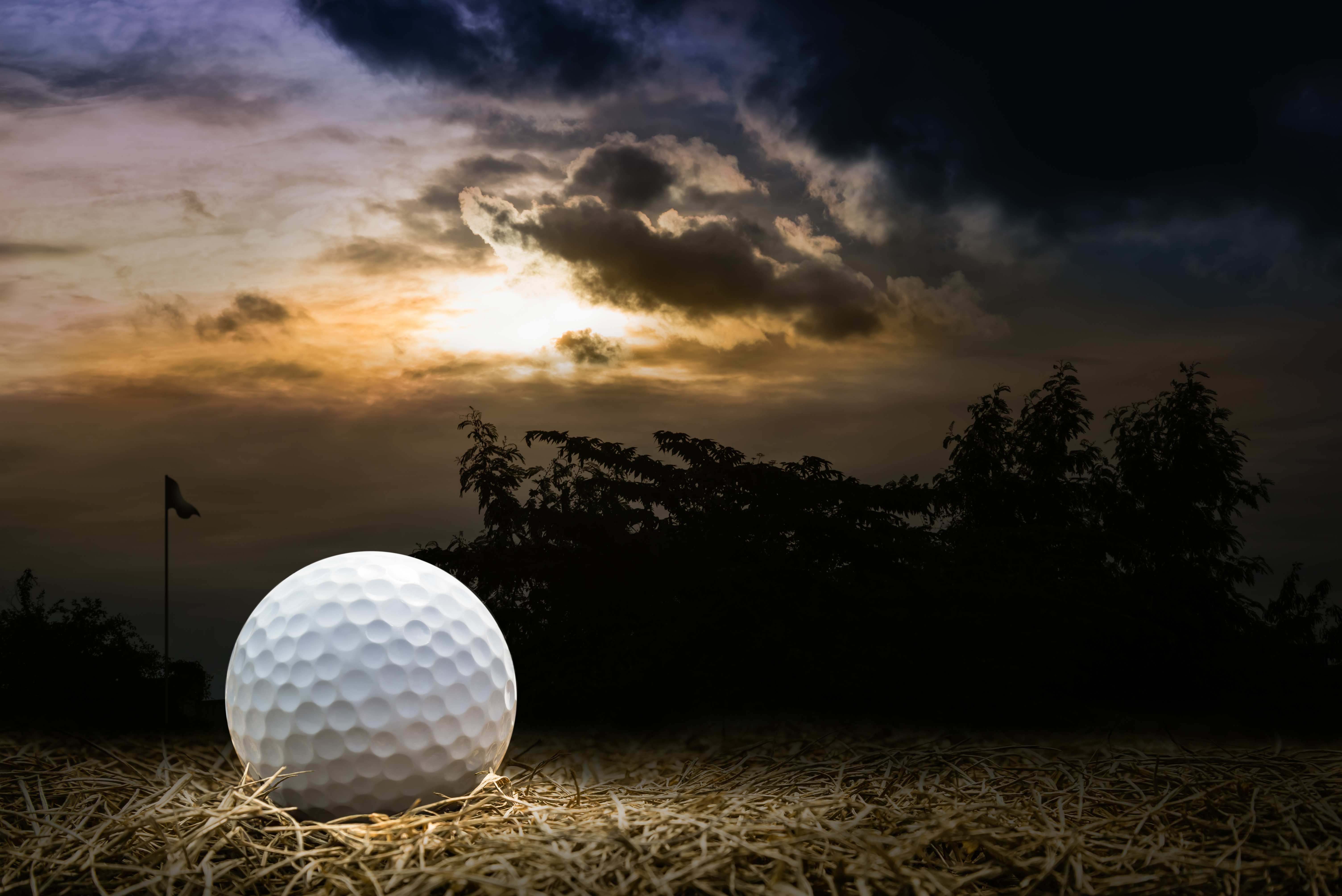 Golf ball on course at night time